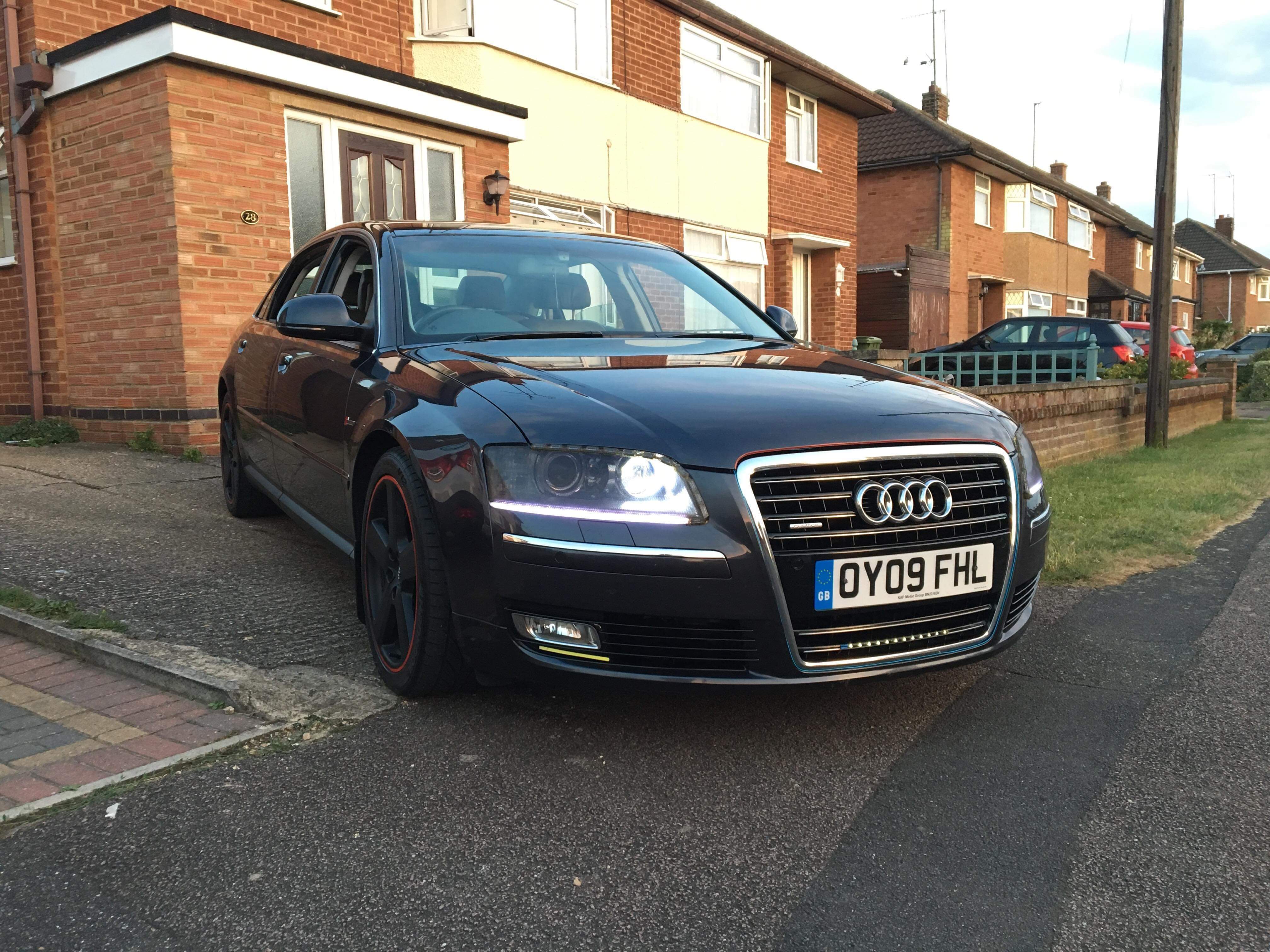 A dark Audi photographed from the front